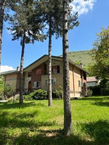 a house with a group of trees in front of it at VILLA OLGA in Cese