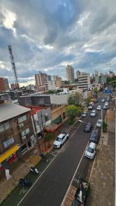 an aerial view of a city with cars parked on a street at Departamento San Lorenzo in Posadas