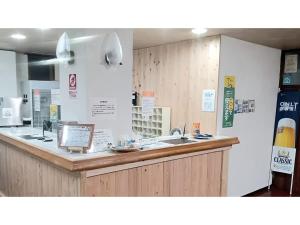 Kitchen o kitchenette sa Onsen Hotel Tsutsujiso - Vacation STAY 03256v