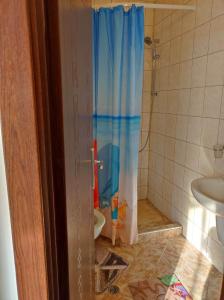a bathroom with a shower with a toilet and a sink at Апартамент - студио в кв Сарафово с морски изглед in Burgas