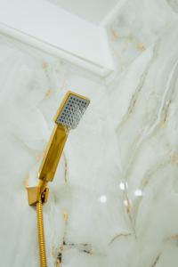 a toothbrush sitting on top of a white marble counter at GoldenLux Apartments in Oradea