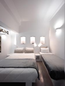 Voodi või voodid majutusasutuse Aggelikoula Rooms toas