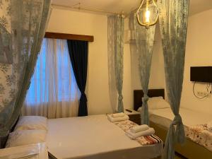 Кровать или кровати в номере Bonjourla Otel