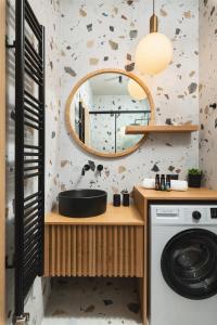 a bathroom with a sink and a mirror at Limani elegant apartments in Souda +91 photos