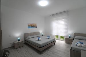 Postel nebo postele na pokoji v ubytování BED & BREAKFAST VAL di ERICE