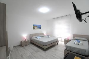 Postel nebo postele na pokoji v ubytování BED & BREAKFAST VAL di ERICE