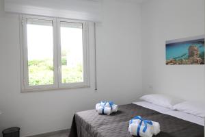 Postel nebo postele na pokoji v ubytování BED & BREAKFAST VAL di ERICE