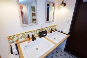 a bathroom with a sink and a mirror at Hotel Sanriiott Kitahama - Vacation STAY 33472v in Osaka