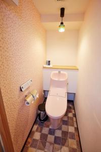 a bathroom with a white toilet in a room at Hotel Sanriiott Kitahama - Vacation STAY 33472v in Osaka