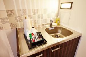 a bathroom with a sink and a counter top at Hotel Sanriiott Kitahama - Vacation STAY 33524v in Osaka