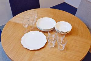 a table with plates and wine glasses on it at Hotel Sanriiott Kitahama - Vacation STAY 33509v in Osaka