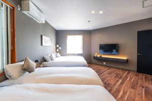 Säng eller sängar i ett rum på Goshikihama Villa - Vacation STAY 36099v
