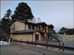 a building with a sign on the side of it at The Haber Motel in Estes Park