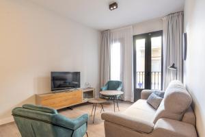 TV a/nebo společenská místnost v ubytování Malaga a Tu Ritmo! Edificio muy tranquilo y moderno!