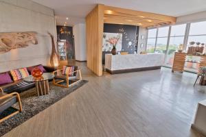 a living room with a couch and a table at GHL Style Yopal in Yopal