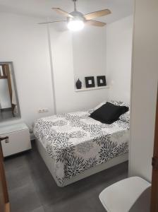 Posteľ alebo postele v izbe v ubytovaní Apartamento CANDELA + 24 fotografií