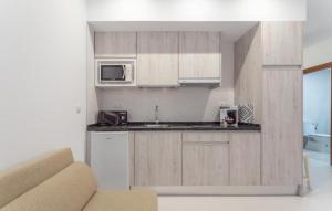 Kuchyňa alebo kuchynka v ubytovaní Villa Augusto Cosy Romance
