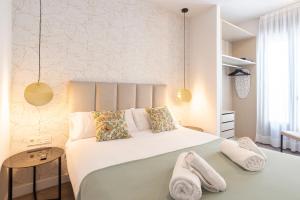 Postel nebo postele na pokoji v ubytování Malaga a Tu Ritmo! Edificio muy tranquilo y moderno!