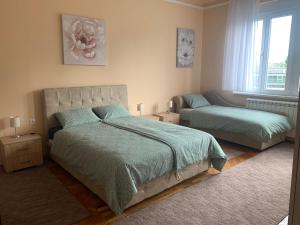 Säng eller sängar i ett rum på Apartment Tašmajdan