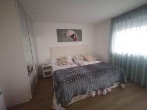 Posteľ alebo postele v izbe v ubytovaní Apartamento con estupendas vistas