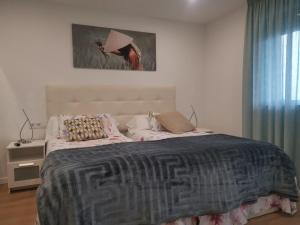 Posteľ alebo postele v izbe v ubytovaní Apartamento con estupendas vistas