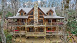 a large wooden house in the woods at Fire And Ice in Blowing Rock
