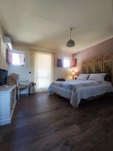 Postel nebo postele na pokoji v ubytování Alloggio Turistico Dakota + 24 fotografií