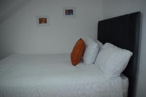 מיטה או מיטות בחדר ב-Forest Gate Haven