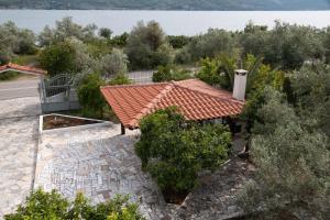 an aerial view of a house with a tile roof at Villa Alex in Agios Georgios