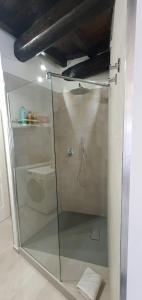 a shower with a glass door in a bathroom at la Dimora del Borgo in Fiumicino