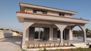 a small house with a patio in front of it at Tenuta Papola B&b in Brindisi