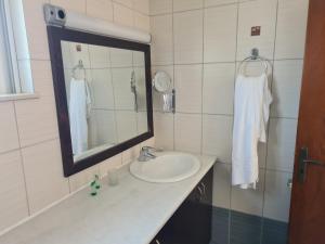 a bathroom with a sink and a mirror at VILLA PAGONI Residence Selini Villas N 1 Kolymbari Chania in Kolymvari +62 photos
