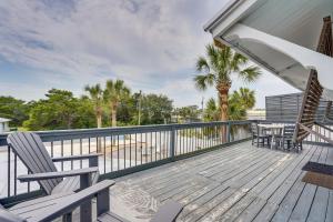 a deck with two chairs and a table on it at PCB Group Retreat with Deck, 1 Block to Beach! in Panama City Beach