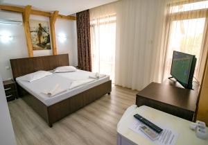 Postel nebo postele na pokoji v ubytování Vila Victory