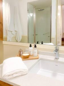 a bathroom counter with a sink and a mirror at jh - Creado como un Hotel Boutique in Buenos Aires