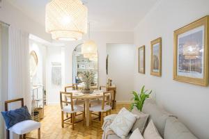 a living room with a couch and a table at jh - Creado como un Hotel Boutique in Buenos Aires +19 photos