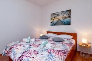 Postel nebo postele na pokoji v ubytování Holiday House Mima