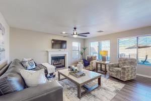 a living room with a couch and chairs and a fireplace at Lemmon Vista in Oro Valley