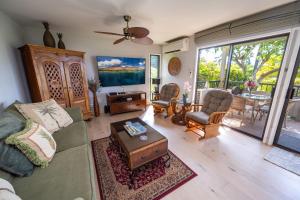a living room with a couch and a table at Ekolu 1403 in Wailea