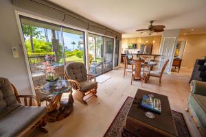 a living room with a couch and a table at Ekolu 1403 in Wailea