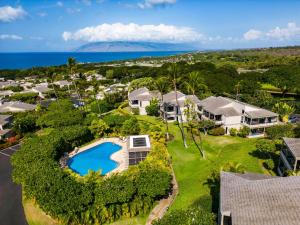 an aerial view of a house with a swimming pool at Ekolu 1403 in Wailea