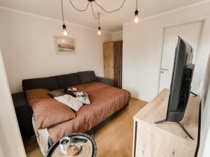 En eller flere senger på et rom på Beautiful Seaside apartement Albatross 23