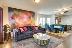 a living room with a couch and a table at Pet-Friendly Davenport Home - Near Casino and Golf in Davenport