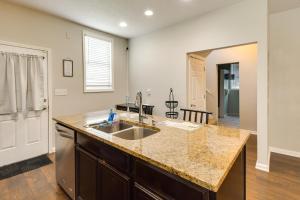 a kitchen with a sink and a counter top at Pet-Friendly Davenport Home - Near Casino and Golf in Davenport +19 photos