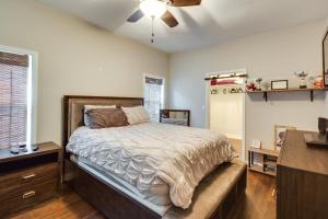 a bedroom with a bed and a dresser and a window at Pet-Friendly Davenport Home - Near Casino and Golf in Davenport