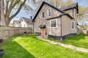 a house with a fence and a yard at Pet-Friendly Davenport Home - Near Casino and Golf in Davenport