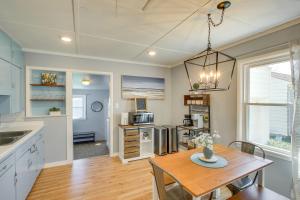 a kitchen and dining room with a table and chairs at Sturgeon Bay Home about 6 Mi to Potawatomi State Park in Sturgeon Bay
