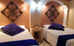 Ліжко або ліжка в номері Hotel Real Catedral
