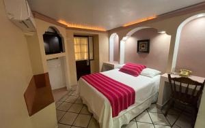 Ліжко або ліжка в номері Hotel Real Catedral