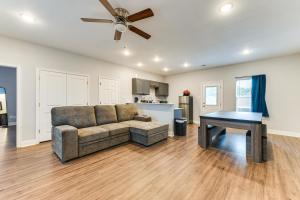 a living room with a couch and a table at Texas Family Home with Hot Tub 1 Mi to Lake Whitney in Whitney